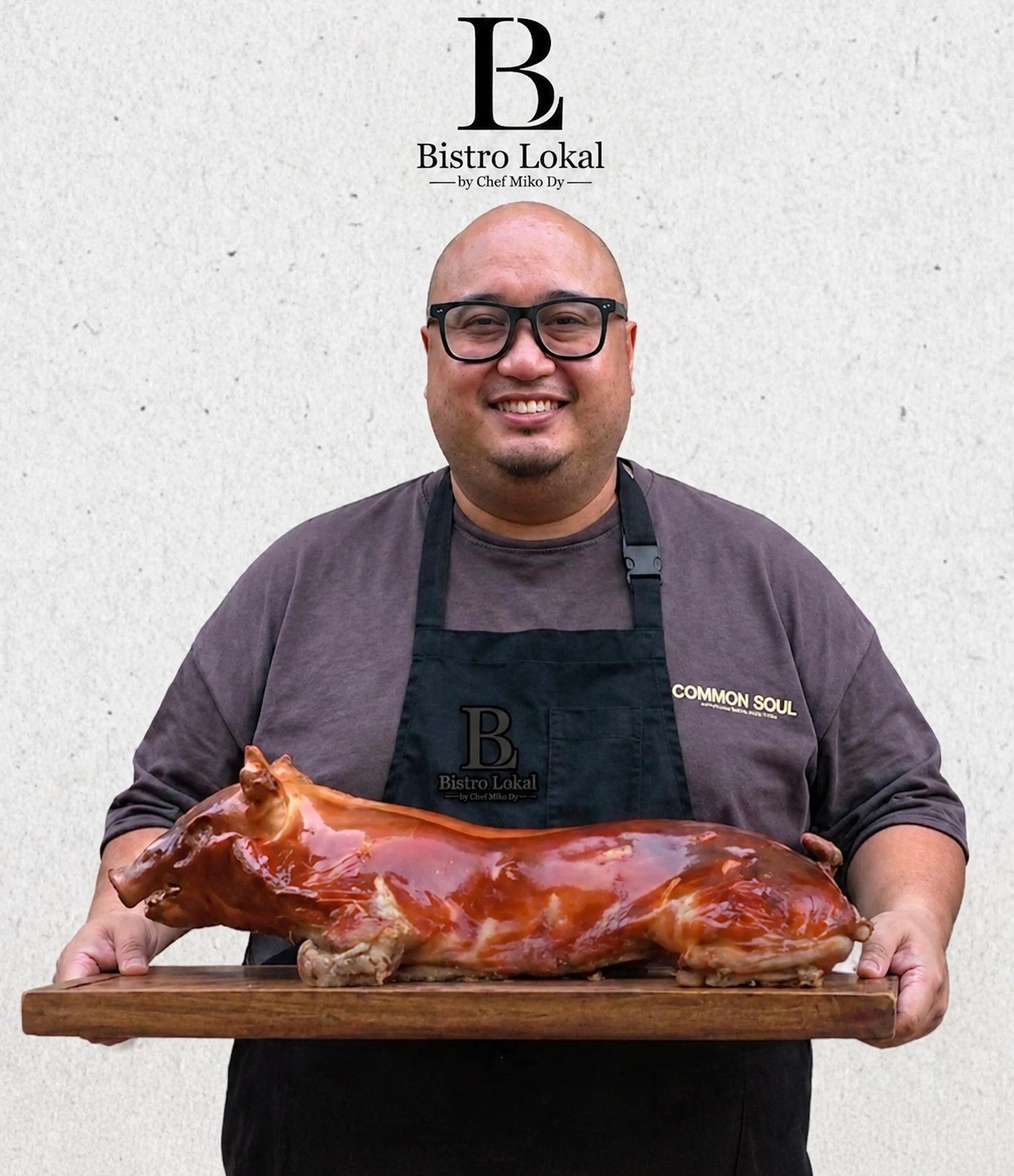 Chef Miko Dy holding signature Cochinillo